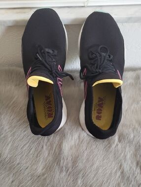 New Balance Black Athletic Sneakers with Pink and Yellow Accents